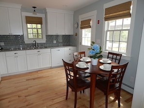 Spacious kitchen with lovely breakfast table with seating for 4. 