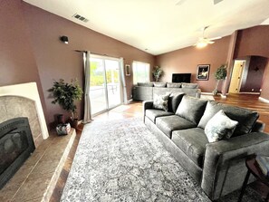 Sofa bed and sectional couch in vast great room.