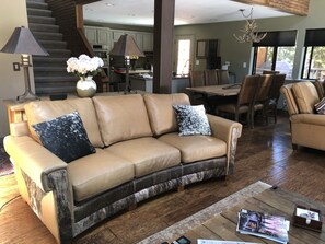 Living room refurbished with decorator-level leather seating in 2021.
