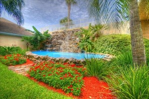 What Beautiful Flowers Outside The Pool Waterfall