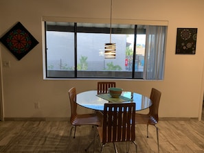 Dining area with view of pool.
