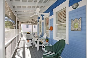 Cozy wrap around porch to relax and enjoy the gulf breezes!