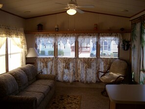 WINDLASS WAY--
Livingroom with sleeper sofa! TV/DVD. Entry to outside Deck!
