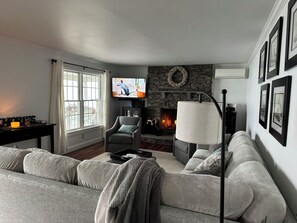 Recently redecorated living room with new paint and furnishings.