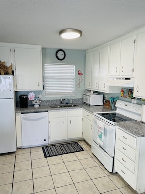 Granite counter tops in kitchen with regular and Keurig coffee maker