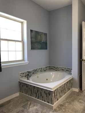 Jacuzzi tub in master bathroom. The perfect place to start your vacation after a long drive. 