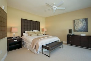 Master bedroom with king bed and television