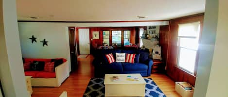 Family Room/Dining Area Looking out from Kitchen to the Screened in Patio