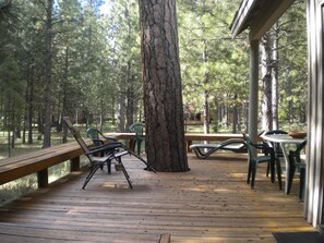 Large, private deck surrounded by wooded common area.