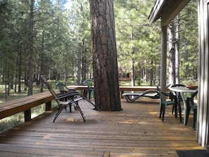 Large, private deck surrounded by wooded common area.