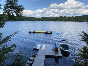 Large dock with two water trampolines, log, and Lilly pad