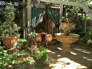 Back garden where guests can read your enjoy a glass of wine.