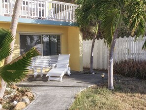 Large windows provide a great view of the yard and ocean beyond.
