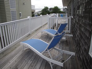 Side of house with additional deck space.