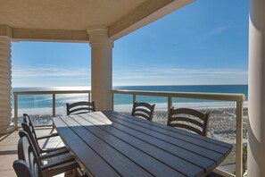 Have a nice meal on the balcony as you watch dolphins swim along the Gulf!