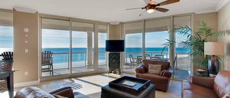 Spacious living area with gorgeous unobstructed views of the Gulf and sunsets!