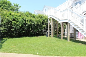 Some back yard space - tables - chairs - grille - outdoor shower