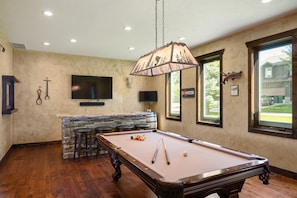 Billiard room with wet bar complete with refrigerator and ice machine