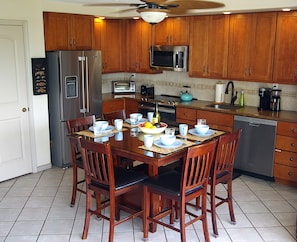 Counter top height dining table seats 6.
New stainless steel appliances.