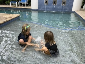 Pool wading area with fountain. 