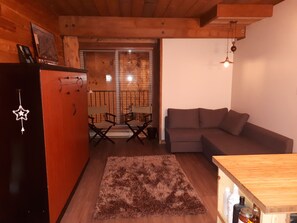 Cozy suite with Murphy bed, couch, and sitting area.