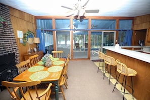 Kitchen and dining area overlooks lakefront view and huge screened porch 