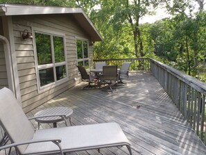 Huge wrap-around deck with comfortable deck furniture great for outdoor dining