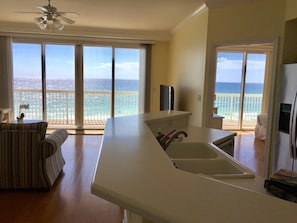 View from the kitchen into the living room and master bedroom.