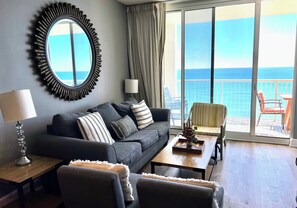 Livingroom open to balcony,  65" flat screen smart TV; queen size pull out sofa