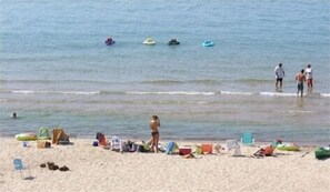 Private beach in front of cottage.
