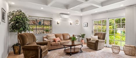 Family room overlooking garden with queen size sleeper sofa. 