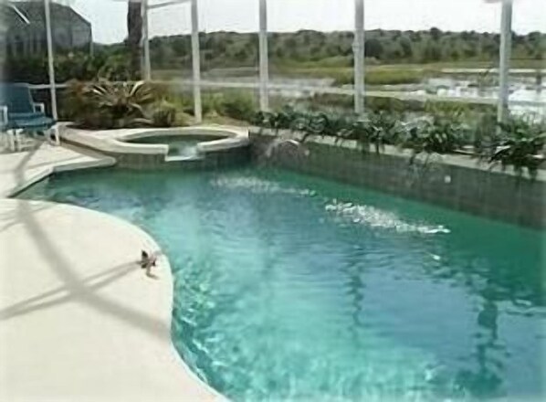 Large private pool looks over wildlife pond/area