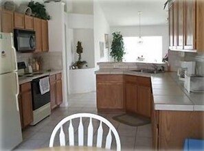 Large sunny eat-in kitchen area