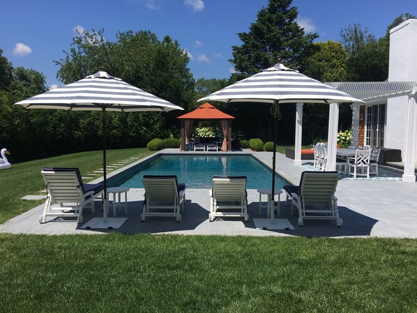 Heated Salt Water Pool. Lounge Chairs with Sunbrella Cushions. Two Umbrellas.
