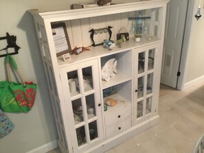 Hutch full of the dishes needed to entertain