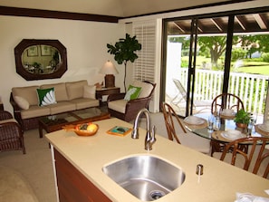 Fully remodeled open concept kitchen looks out onto private tropical gardens. 