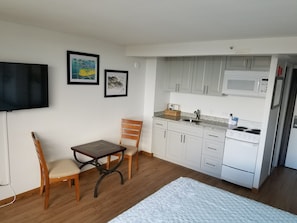Studio A with full kitchen, sitting area and 43 in smart TV