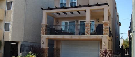 Front of house. Balcony is for the upstairs unit only. Welcome to Hermosa Beach!
