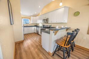 Cozy, bright kitchen featuring modern appliances.