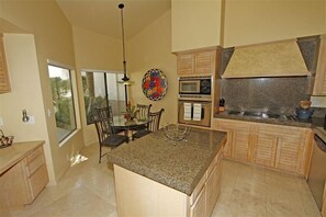 Up-dated eat-in kitchen
with granite counter tops and stainless appliances.