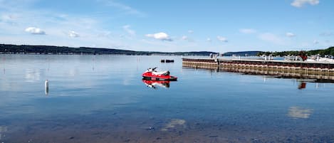 View of Lake Charlevoix from pool. (Jet ski does not come with rental!)