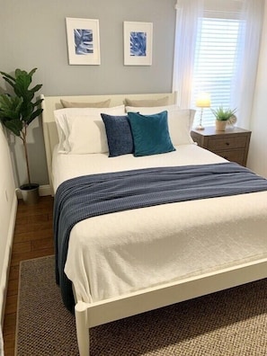 Coastal bedroom, with room for a twin roll out or crib!