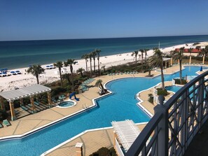 Balcony overlooks pool and beach without sacrificing personal privacy.
