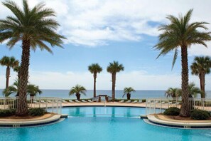 En Soleil seasonal heated swimming pool  with gorgeous views of the ocean.