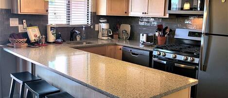 newly remodeled kitchen, quartz counter tops and updated cabinets 