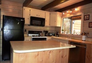 Fully stocked kitchen with all new pots, pans, plates, wine glasses, everything!