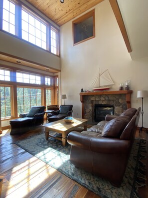 Large comfy living room features a see-thru gas fireplace!