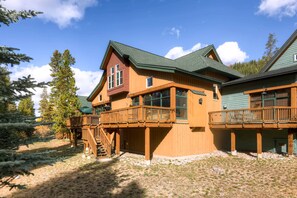 Back of townhome with huge deck and plenty of space to hike, fish on White River
