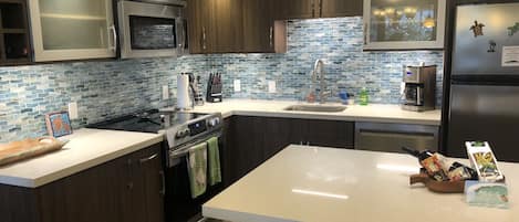 Beautifully remodeled kitchen with modern stainless steel appliances.