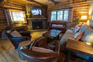 Front sitting room with stone fireplace